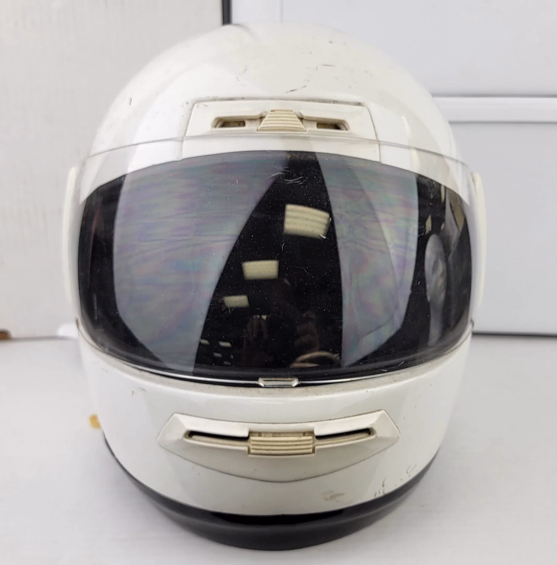 Why do bikers tap the top of their helmets?